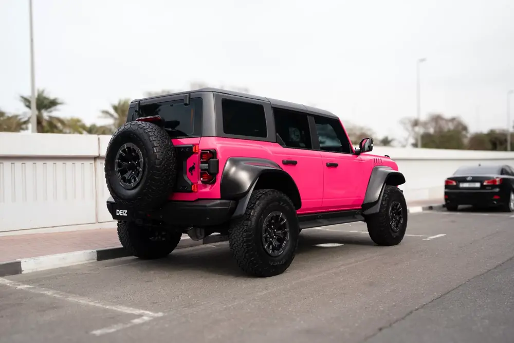 Ford Bronco Raptor after a vivid pink full-body wrap by DEIZ Garage