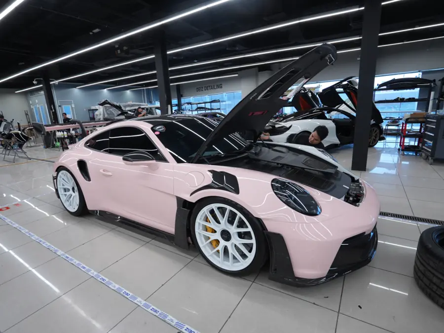 Porsche 911 after a gloss pink full-body wrap at DEIZ