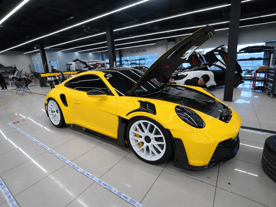 Porsche 911 in its original yellow in the DEIZ workshop